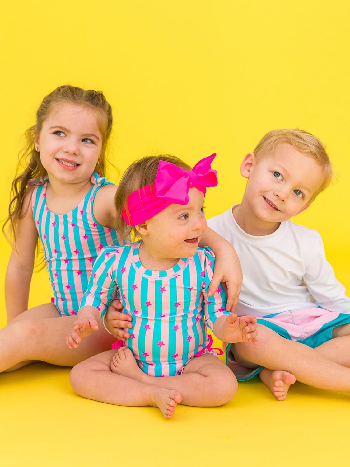 RuffleButts Baby Girls UPF 50+ Sun Protection Novelty Print Long Sleeve One Piece Rash Guard Swimsuit with Zipper