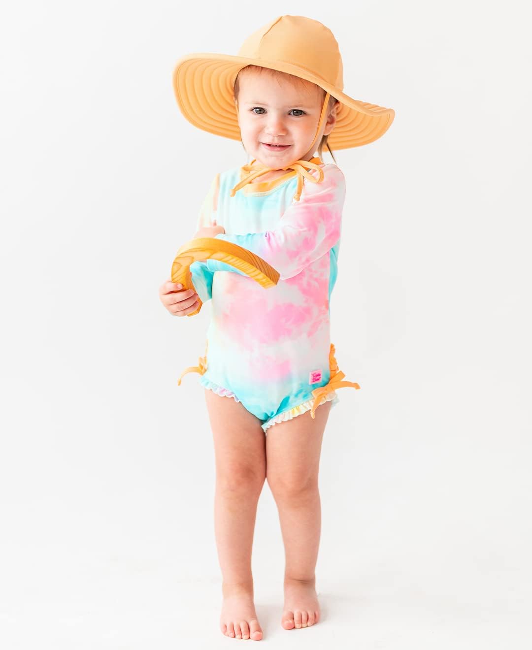 RuffleButts Baby Girls UPF 50+ Sun Protection Novelty Print Long Sleeve One Piece Rash Guard Swimsuit with Zipper
