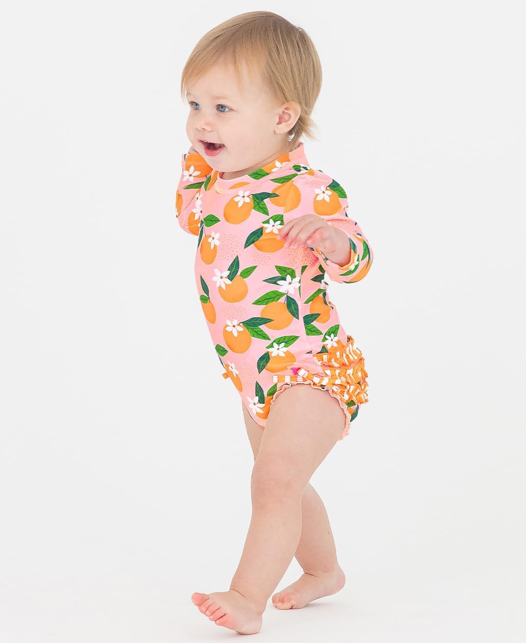 RuffleButts Baby Girls UPF 50+ Sun Protection Novelty Print Long Sleeve One Piece Rash Guard Swimsuit with Zipper