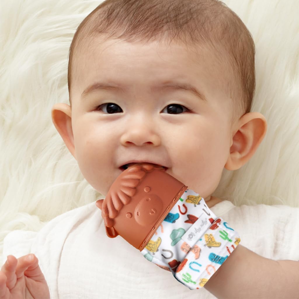 Itzy Ritzy Silicone Teething Mitt - Soothing Infant Teething Mitten with Adjustable Strap, Crinkle Sound & Textured Silicone to Soothe Sore & Swollen Gums - for Ages 3 Months & Up (Cow)