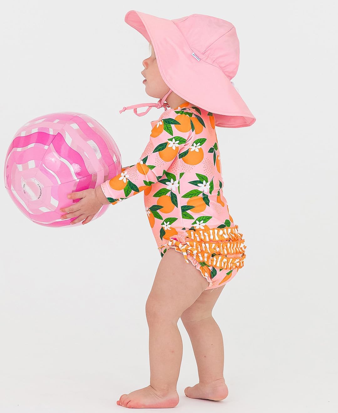 RuffleButts Baby Girls UPF 50+ Sun Protection Novelty Print Long Sleeve One Piece Rash Guard Swimsuit with Zipper