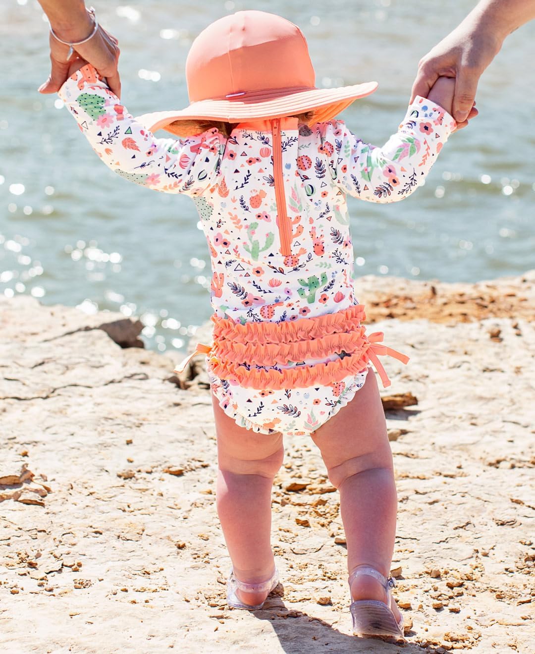RuffleButts Baby Girls UPF 50+ Sun Protection Novelty Print Long Sleeve One Piece Rash Guard Swimsuit with Zipper