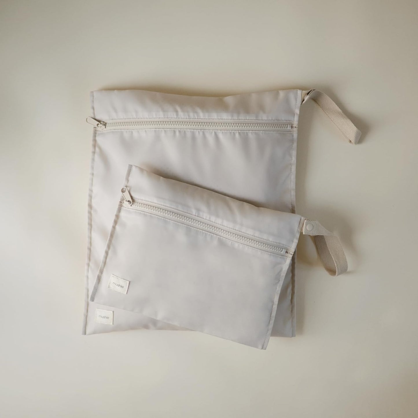 mushie Water Resistant Wet Bags | Large & Small Reusable Storage Bag for Baby Items and Travel | Zippered Pockets with Handle | Machine Washable, Set of 2 (Fog)