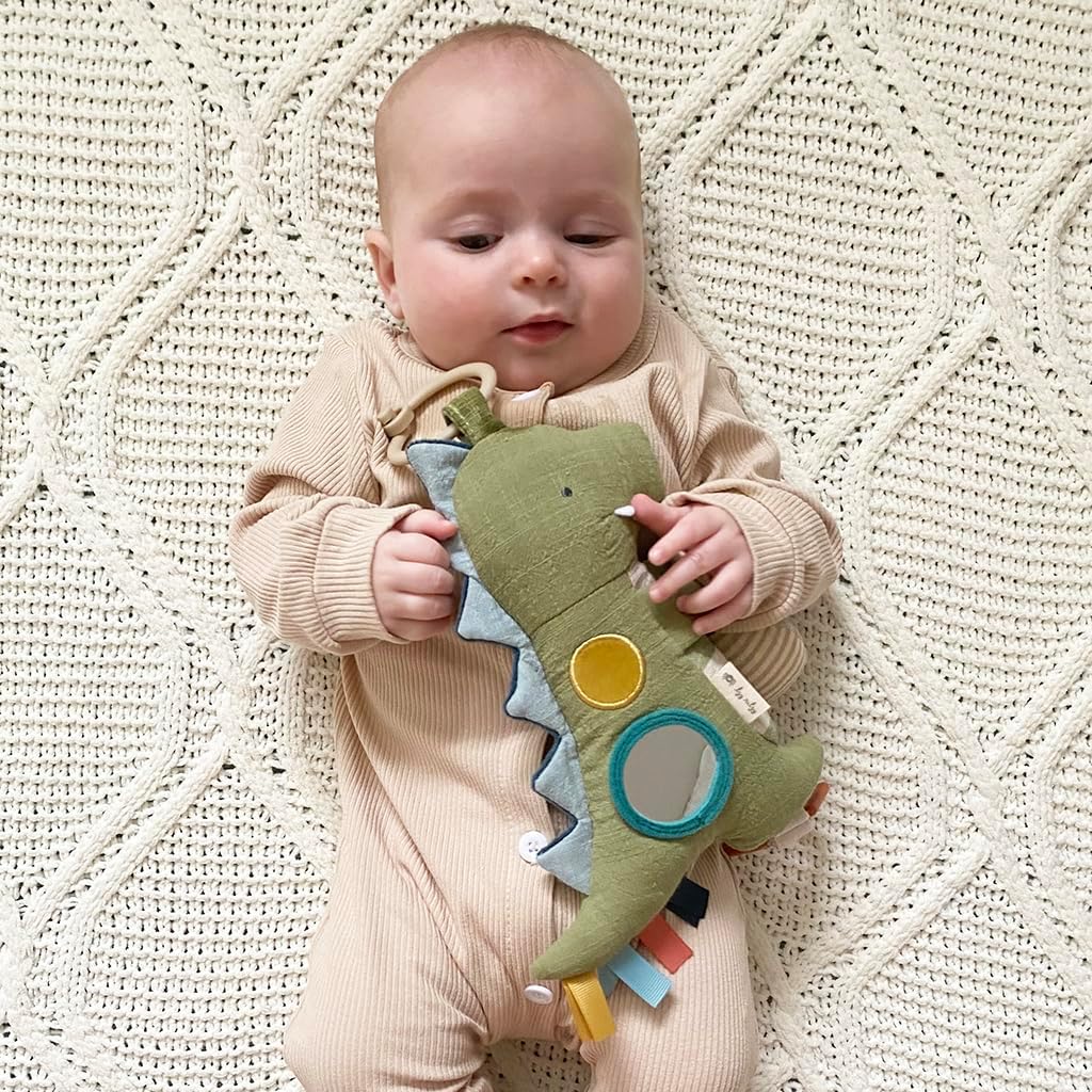 Itzy Ritzy Bitzy Traveler Car Seat & Stroller Toy for Babies – Developmental Sensory Toy Features Crinkle & Rattle Sounds & Multiple Textures –Hanging Travel Toy for On-the-Go Entertainment (Dinosaur)