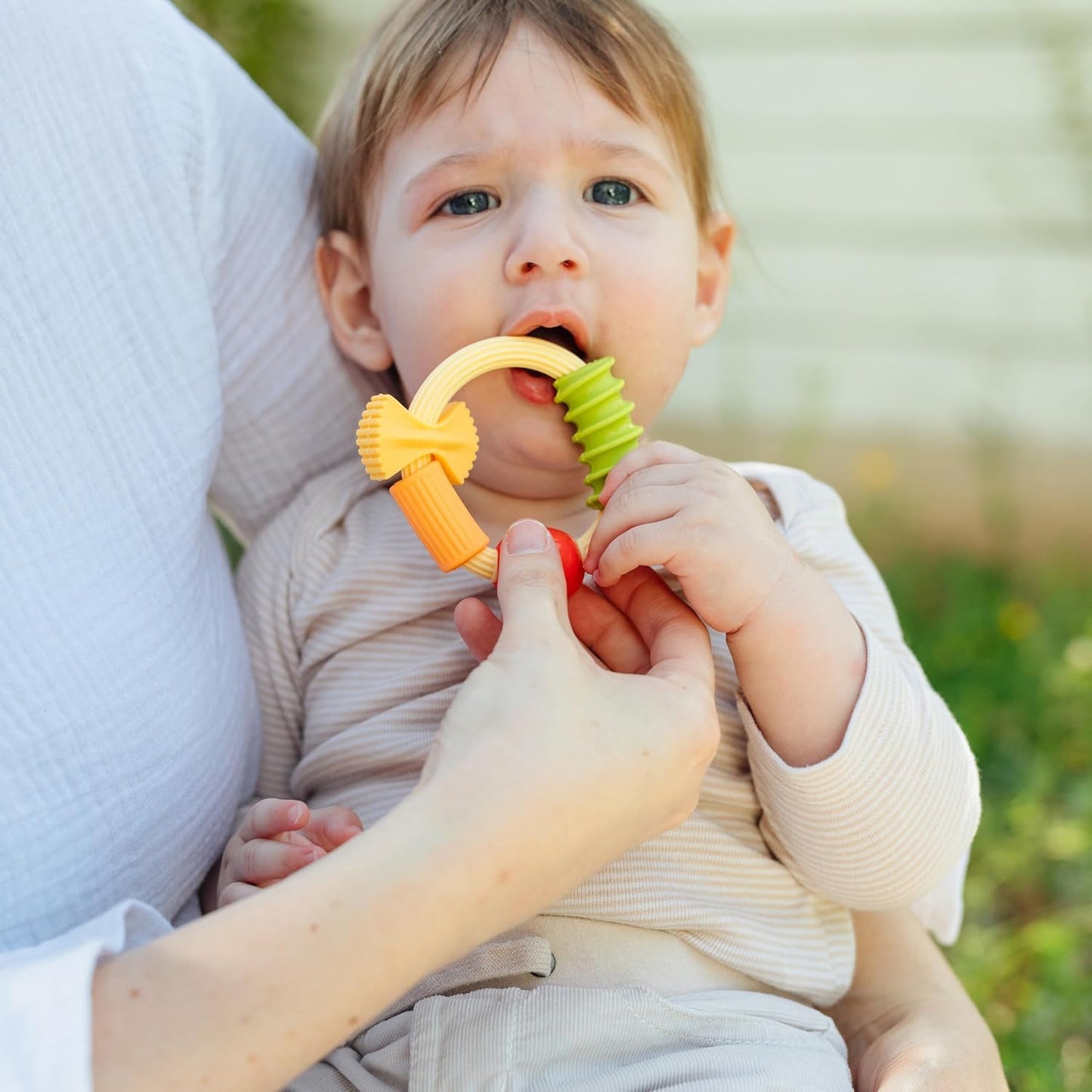 Nuby Pasta Ring Teether - Soft Silicone, Multi-Textured Surface, Easy Grip, Teething Relief for Babies 3+ Months
