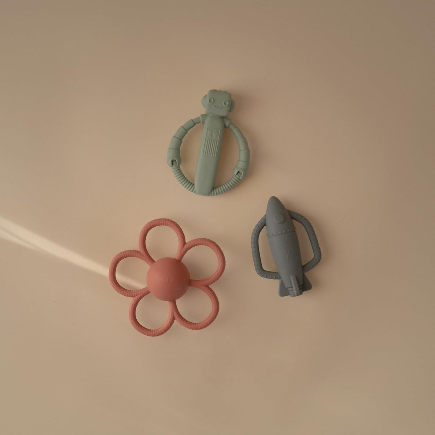 mushie Silicone Baby Rocket Rattle Teether Toy