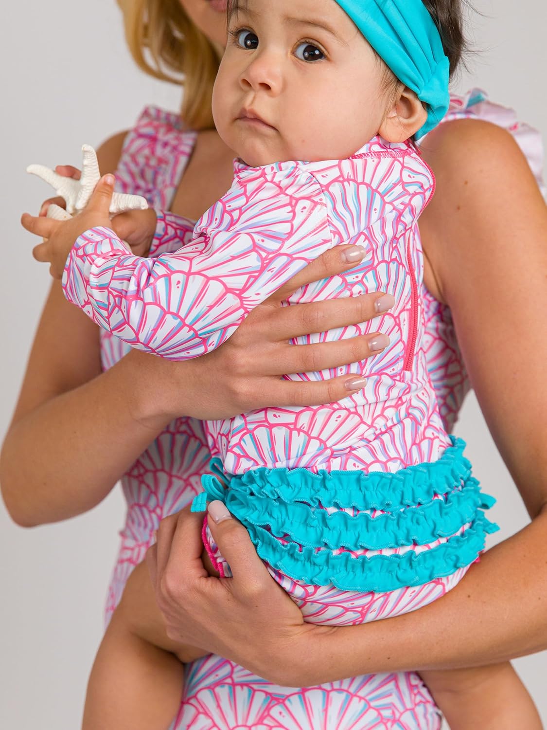 RuffleButts Baby Girls UPF 50+ Sun Protection Novelty Print Long Sleeve One Piece Rash Guard Swimsuit with Zipper