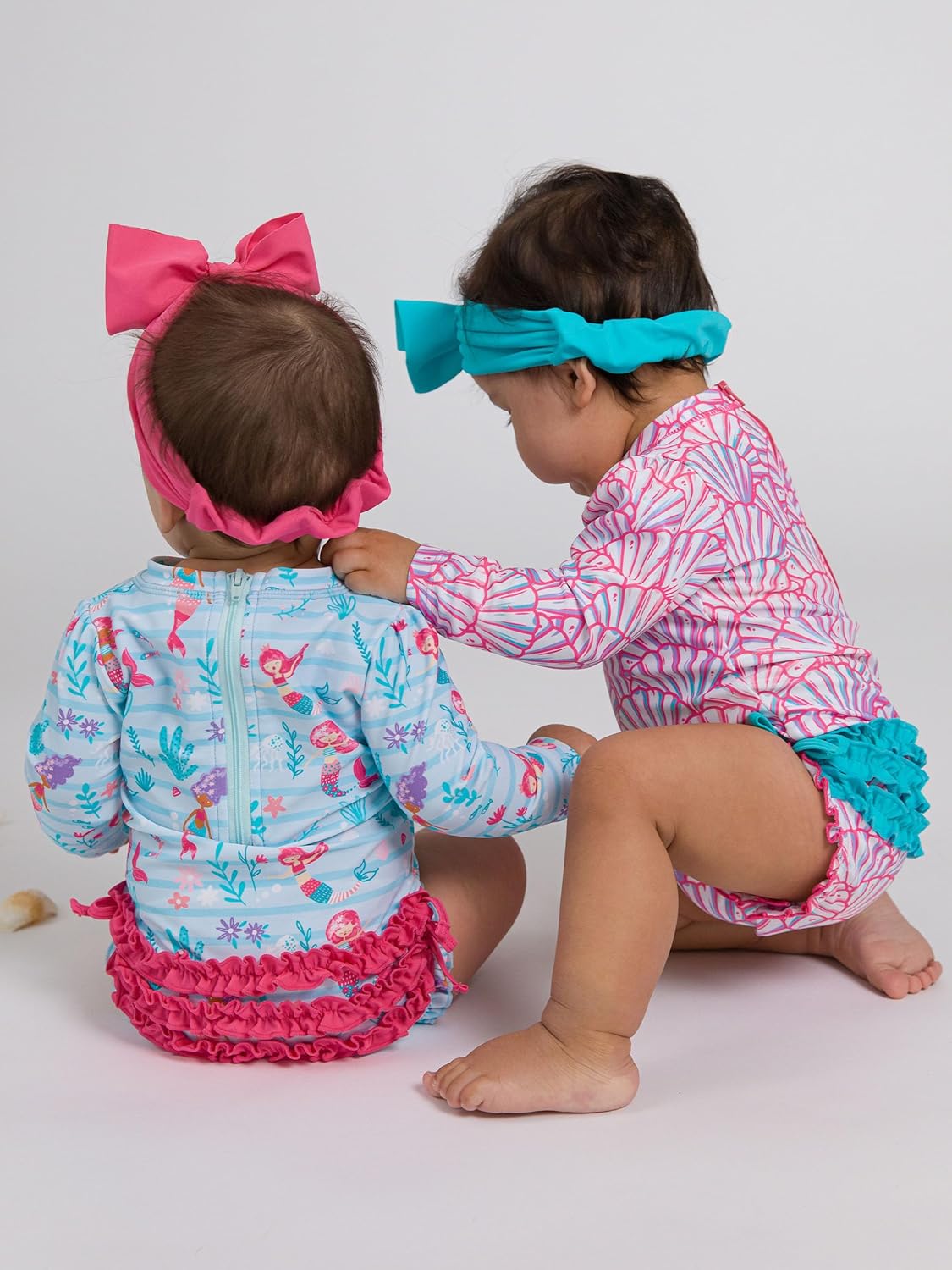 RuffleButts Baby Girls UPF 50+ Sun Protection Novelty Print Long Sleeve One Piece Rash Guard Swimsuit with Zipper
