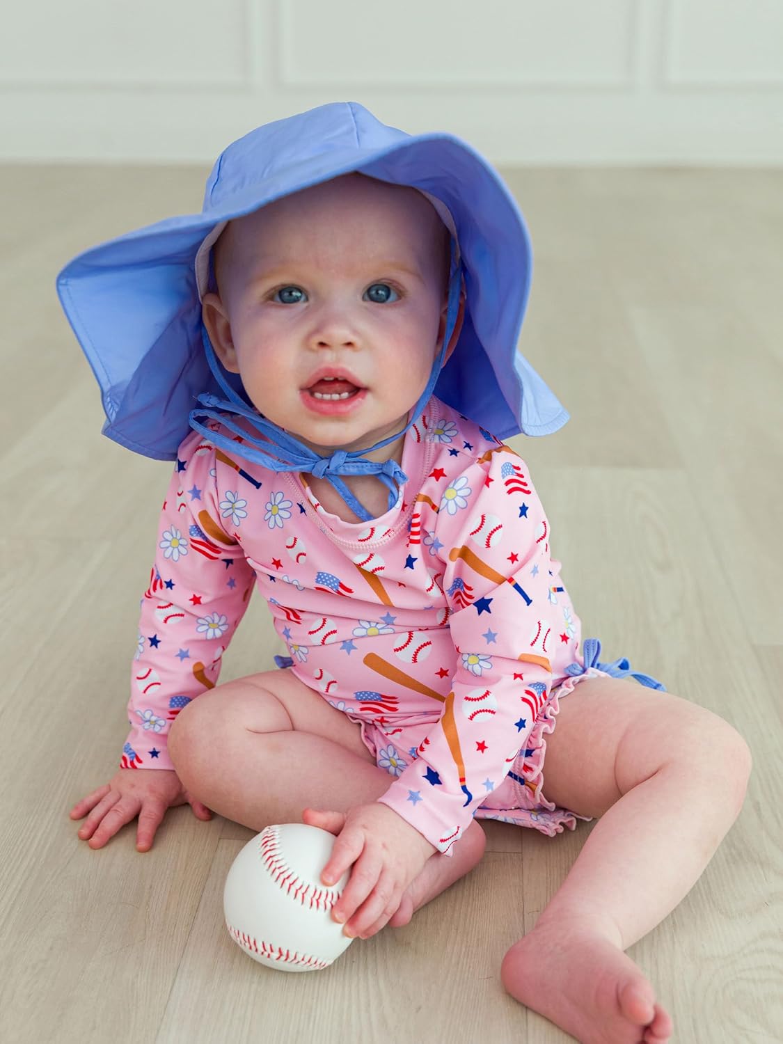 RuffleButts Baby Girls UPF 50+ Sun Protection Novelty Print Long Sleeve One Piece Rash Guard Swimsuit with Zipper