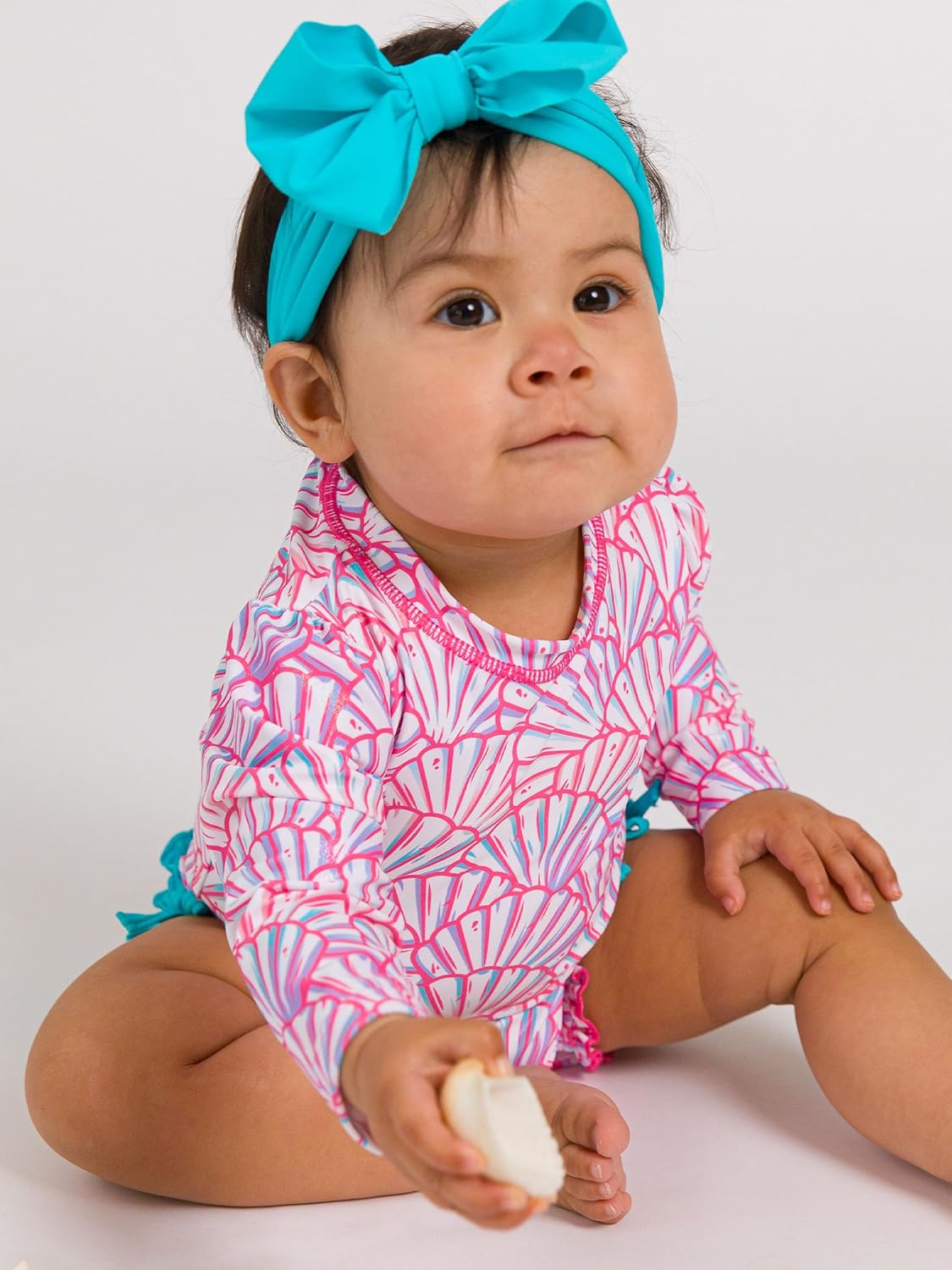 RuffleButts Baby Girls UPF 50+ Sun Protection Novelty Print Long Sleeve One Piece Rash Guard Swimsuit with Zipper