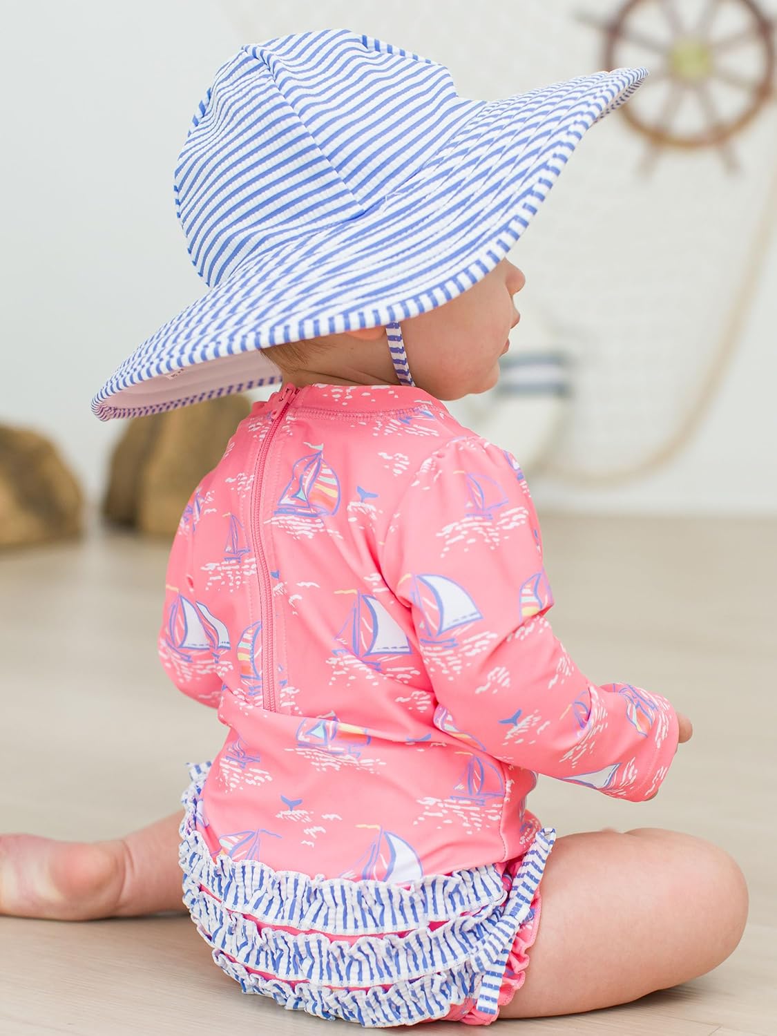 RuffleButts Baby Girls UPF 50+ Sun Protection Novelty Print Long Sleeve One Piece Rash Guard Swimsuit with Zipper