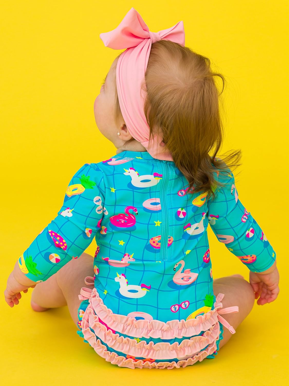 RuffleButts Baby Girls UPF 50+ Sun Protection Novelty Print Long Sleeve One Piece Rash Guard Swimsuit with Zipper