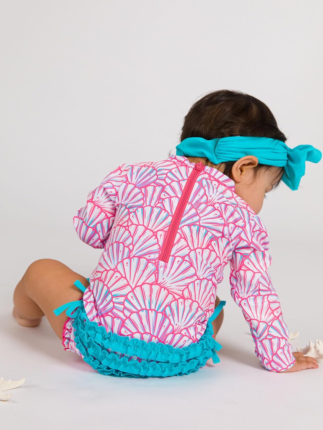 RuffleButts Baby Girls UPF 50+ Sun Protection Novelty Print Long Sleeve One Piece Rash Guard Swimsuit with Zipper