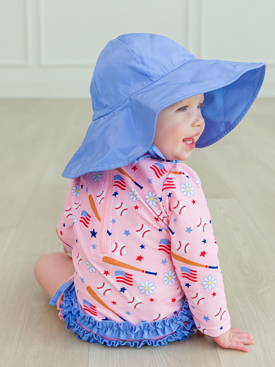RuffleButts Baby Girls UPF 50+ Sun Protection Novelty Print Long Sleeve One Piece Rash Guard Swimsuit with Zipper
