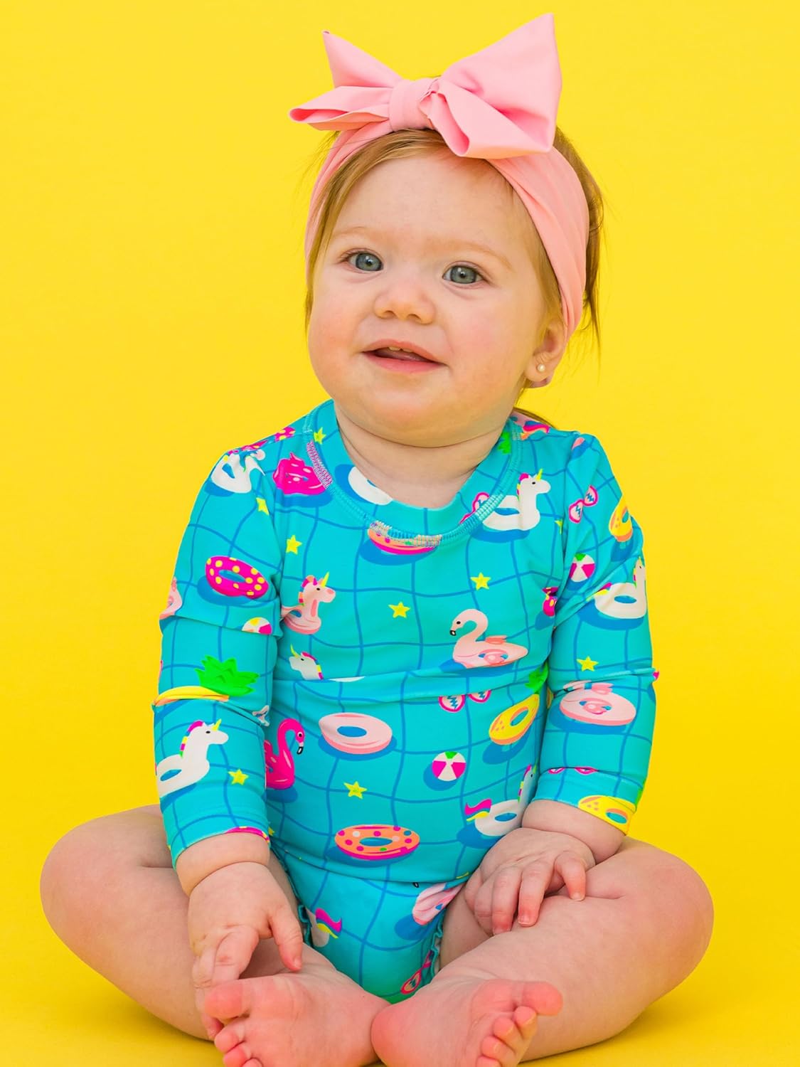 RuffleButts Baby Girls UPF 50+ Sun Protection Novelty Print Long Sleeve One Piece Rash Guard Swimsuit with Zipper