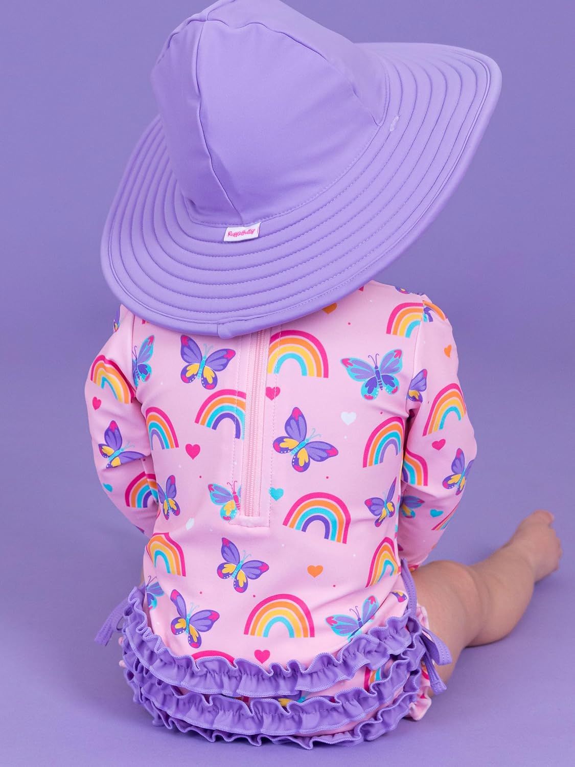 RuffleButts Baby Girls UPF 50+ Sun Protection Novelty Print Long Sleeve One Piece Rash Guard Swimsuit with Zipper