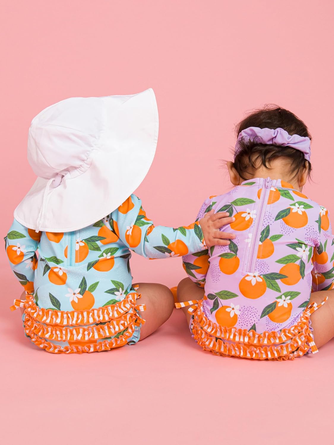 RuffleButts Baby Girls UPF 50+ Sun Protection Novelty Print Long Sleeve One Piece Rash Guard Swimsuit with Zipper