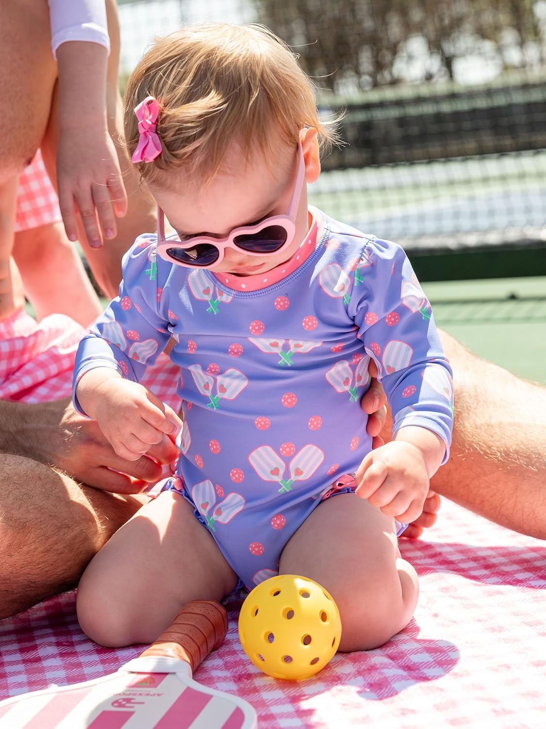 RuffleButts Baby Girls UPF 50+ Sun Protection Novelty Print Long Sleeve One Piece Rash Guard Swimsuit with Zipper
