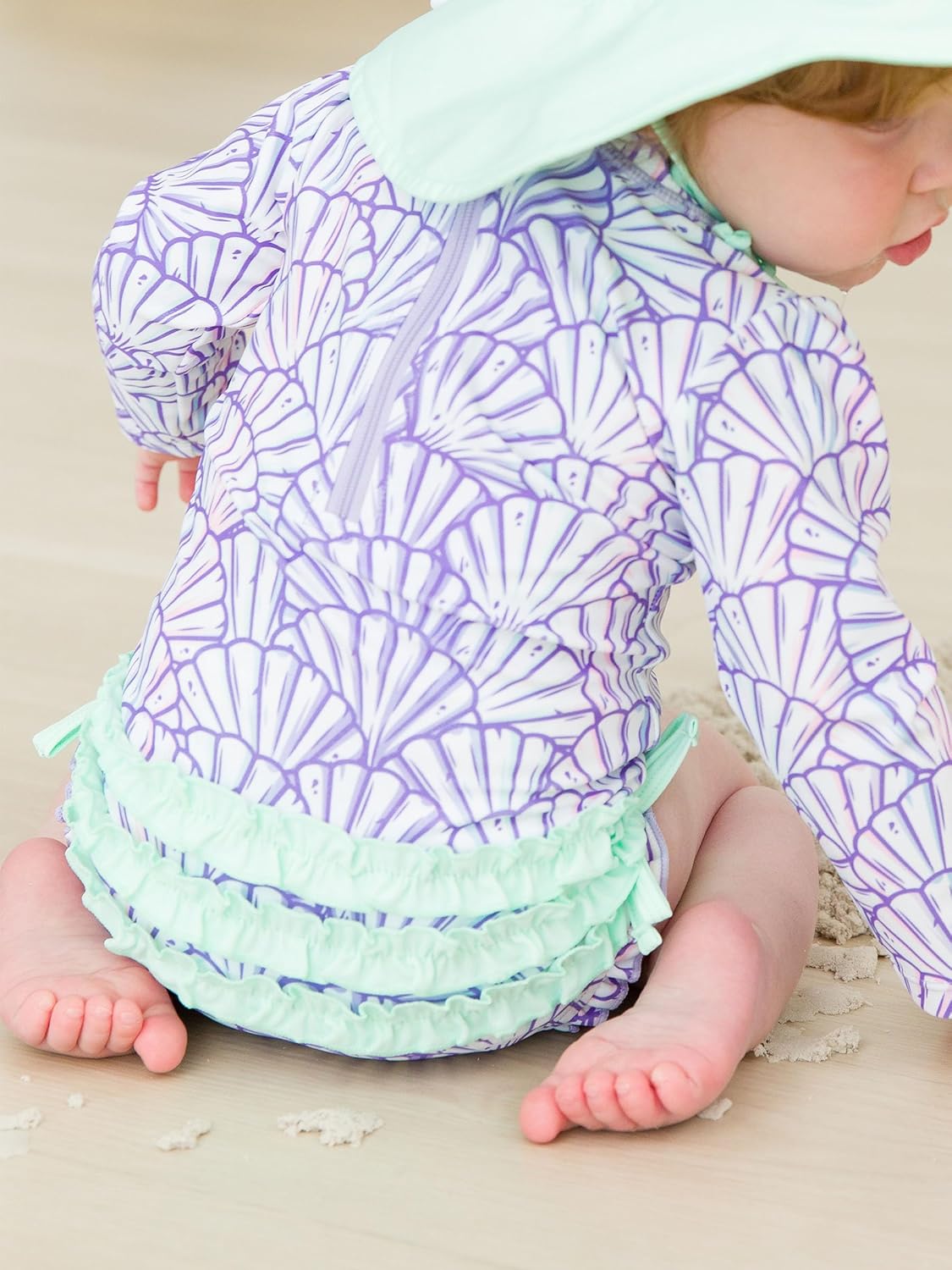 RuffleButts Baby Girls UPF 50+ Sun Protection Novelty Print Long Sleeve One Piece Rash Guard Swimsuit with Zipper